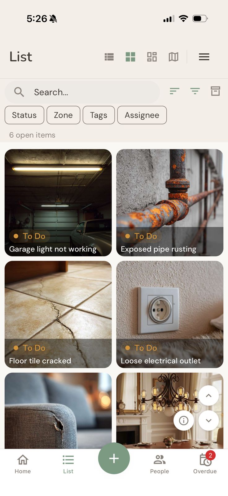 The photo grid view with large photo tiles, each showing the item title and status badge